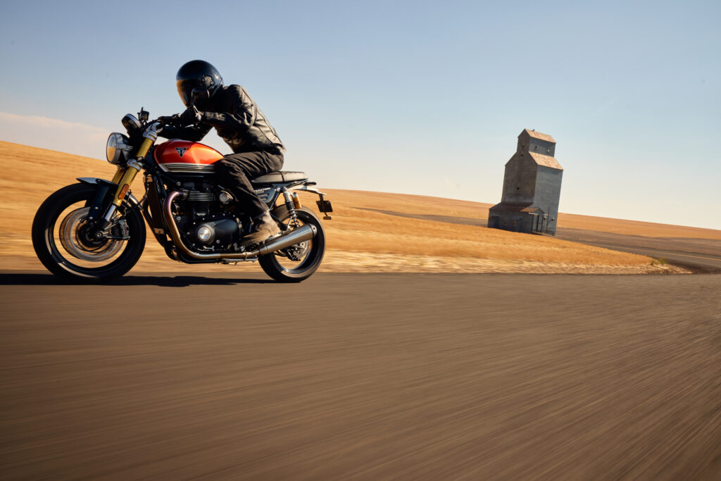 Triumph Speed Twin 1200 RS parked on a scenic road, showcasing its sleek design and modern features